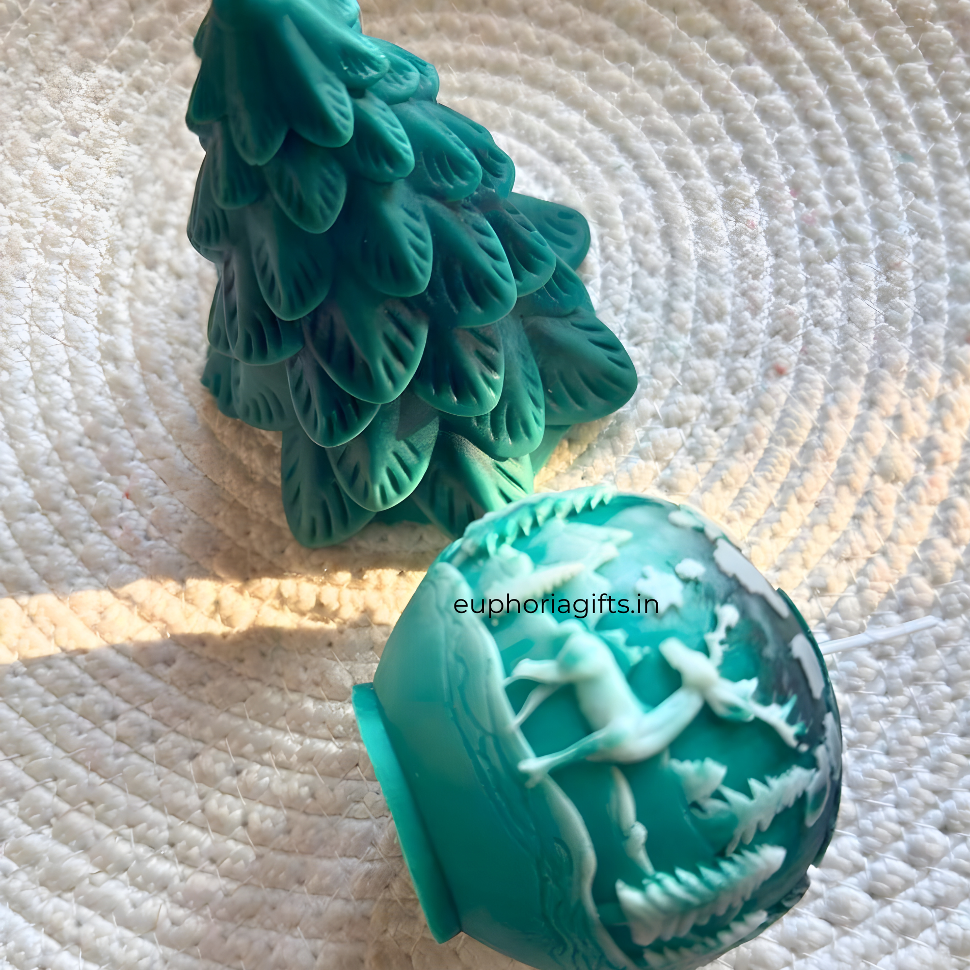 Teal Christmas tree and ornament with reindeer on a textured white  Handmade reindeer design Christmas sphere candlesurface