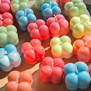Colorful mini bubble candles in vibrant red, blue, and green shades – ideal for party favors, return gifts, and festive decoration.