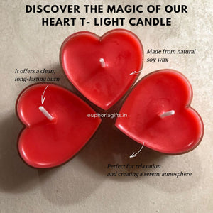 Heart-shaped candles in various colors held by a hand on a white surface with 'euphoriagifts.in' branding.