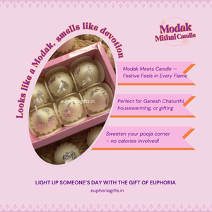 Modak-shaped candles in a box with promotional text on a pink background