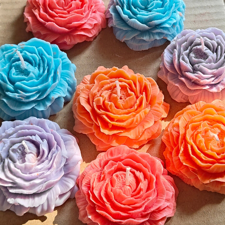 Multicolored peony flower candles with detailed petals arranged on a brown surface. peony flower candles

handmade candles

soy wax candles

aesthetic candles

gift candles

wedding décor candles

romantic candle gift

flower-shaped candles
