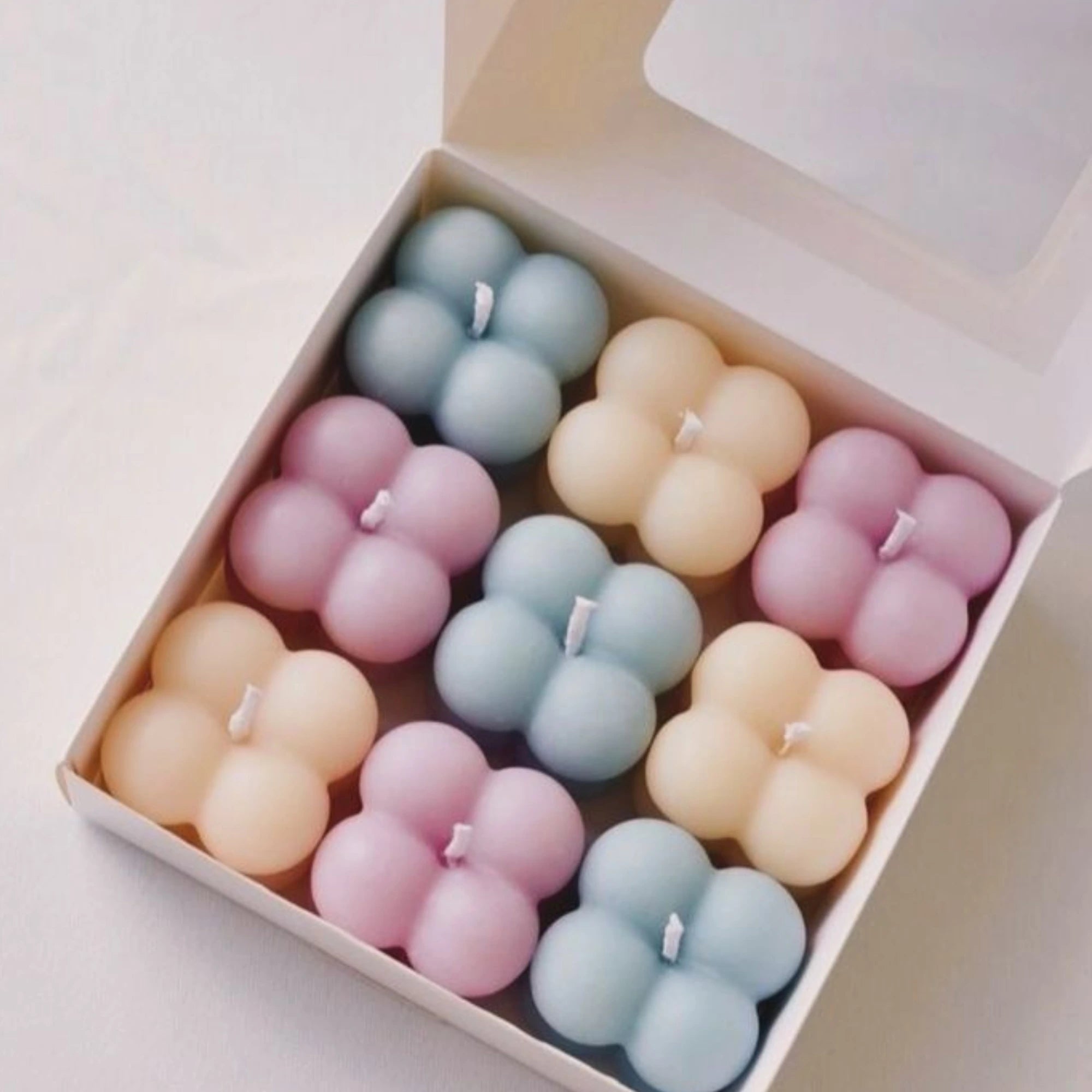 Box of pastel-colored mini bubble candles – handmade soy wax candles for gifting hampers, home accents, or self-care kits . set f 6 mini bubble candle gift.