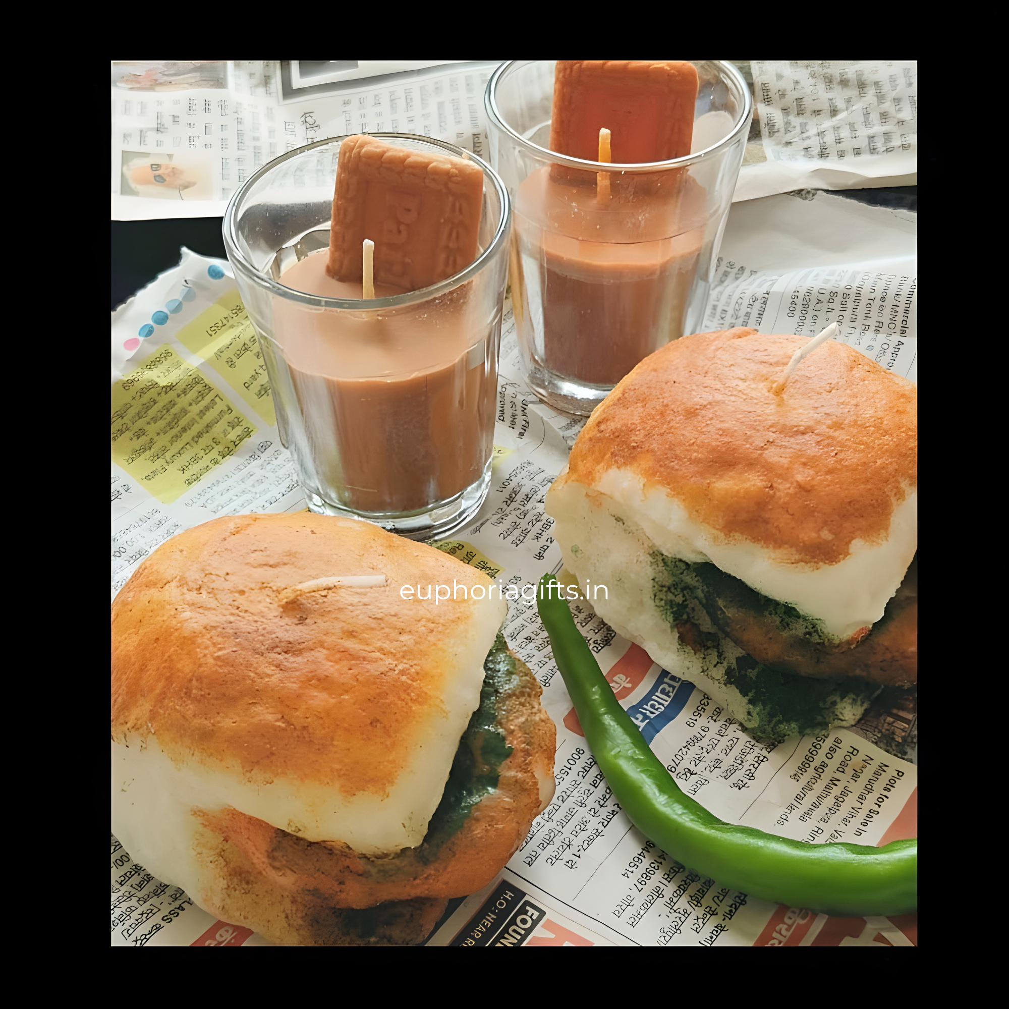 Vada pav with candles in glasses on a newspaper background