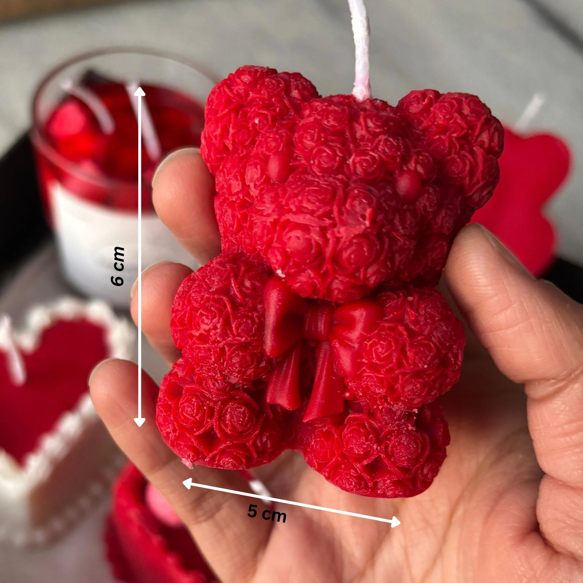 Close-up of scented teddy bear candle made from eco-friendly soy wax